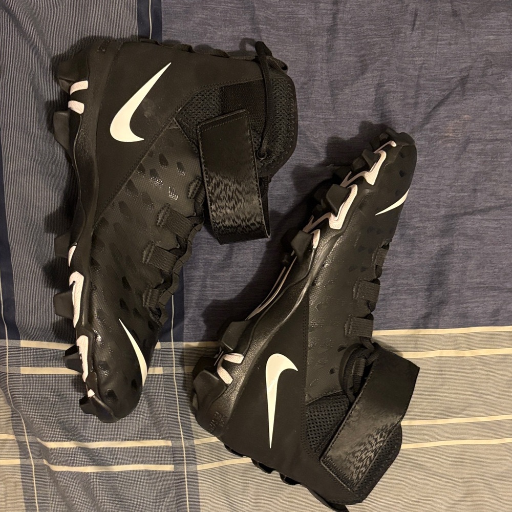 Nike Black Cleats with White Swoosh